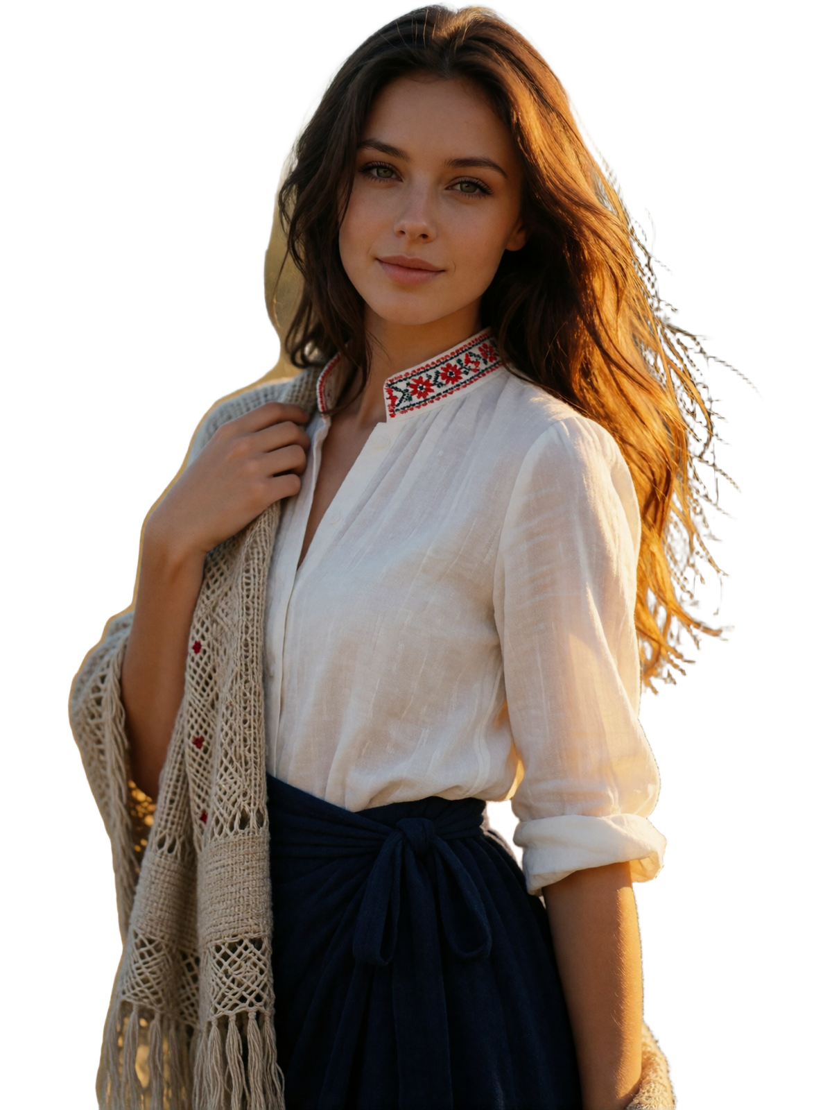 Slovak woman in a red-embroidered blouse and navy wrap skirt standing in a golden mountain valley